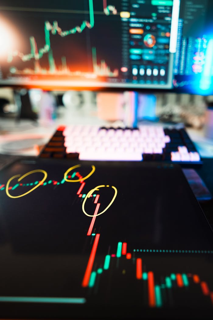 Close-up of cryptocurrency market data visualization on screens with highlighted trends and charts.